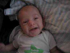 Alex, Hayley's son, smiling as a baby