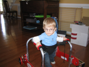 Alex, Hayley's son, who is using a walker 