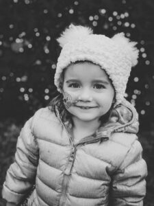 child wearing a winter coat and beanie